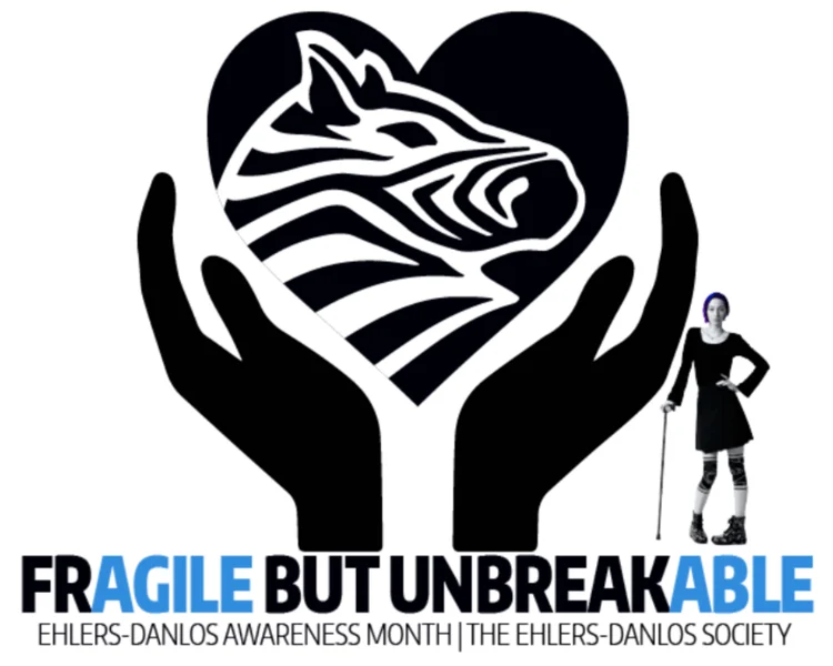 Two hands hold a heart with a zebra pattern. A person with a cane stands beside text reading “Fragile but Unbreakable—Ehlers-Danlos Awareness Month.”.